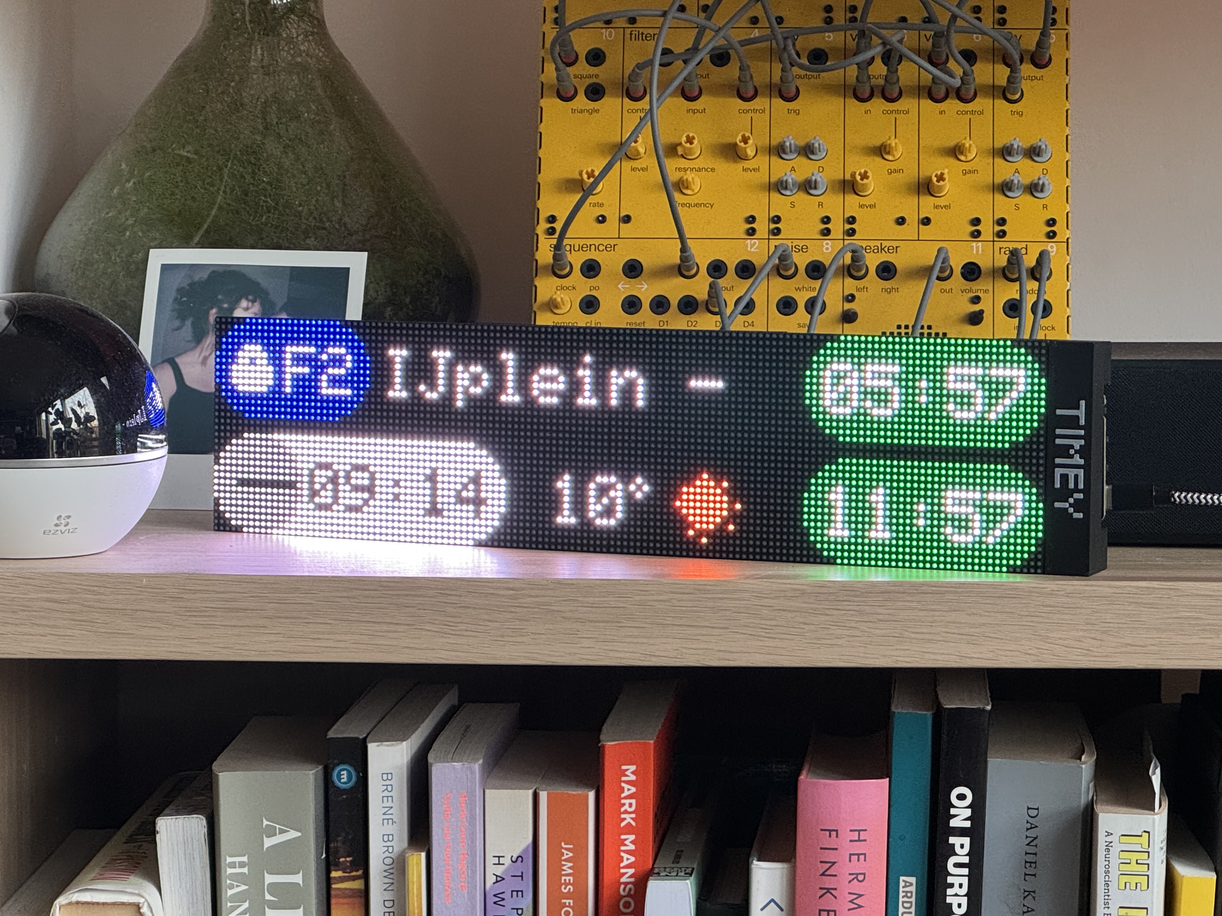 Timey XL on bookshelf